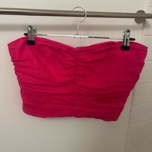 Pink strapless zipper bustier top.